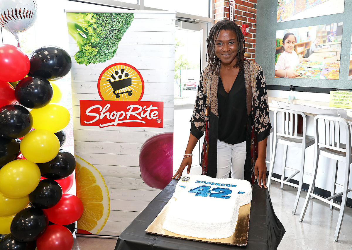 Ayo Robinson at ShopRite accepts donation from ShopRite and Chock full 'Nuts for her father's foundation, the Jackie Robinson Foundation